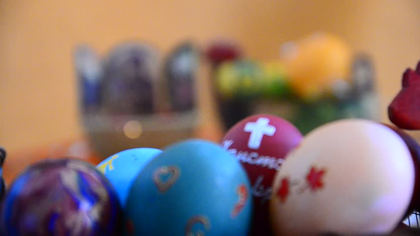 Eggs on Easter, Christian icon focus and eggs change at background