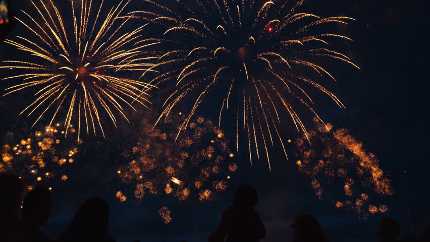 A Spectacular Fireworks Display Lights Up and Illuminates the Night Sky with Beauty and Explosive Color