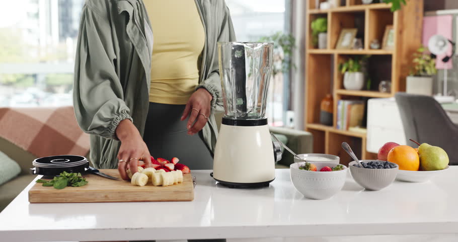 Blender, fruit and hands of woman in kitchen for smoothie with health, wellness or breakfast. Nutrition, morning and female person with organic ingredients for protein shake or drink in apartment.