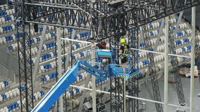 Music concert stage set up buildup construction. stadium football pitch being prepared to host a music concert. sports stadium as technicians set up the stage for the live music event. - Powered by Shutterstock - Get 15% off with code: PIKWIZARD15