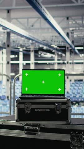 Vertical video Close up of isolated screen laptop in front of data center programmers improving AI rigs processing speed. Server hub coworkers manage gear using chroma key device to support AI