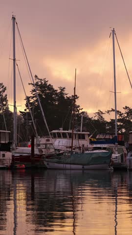 Tranquil Sunset Reflections Over Boats Docked in a Serene Vancouver Island Marina, British Columbia, Canada
