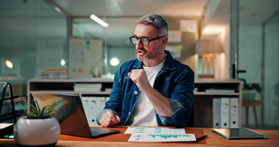 Laptop, video call and laughing with business man for joke, talking or finance at night. Computer, webinar and mature manager in virtual conference, funny story or investment deadline in office