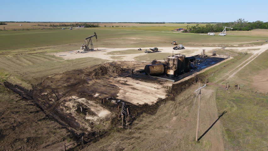 Drone shot over spilled oil and broken containers, Twister aftermath in Kansas