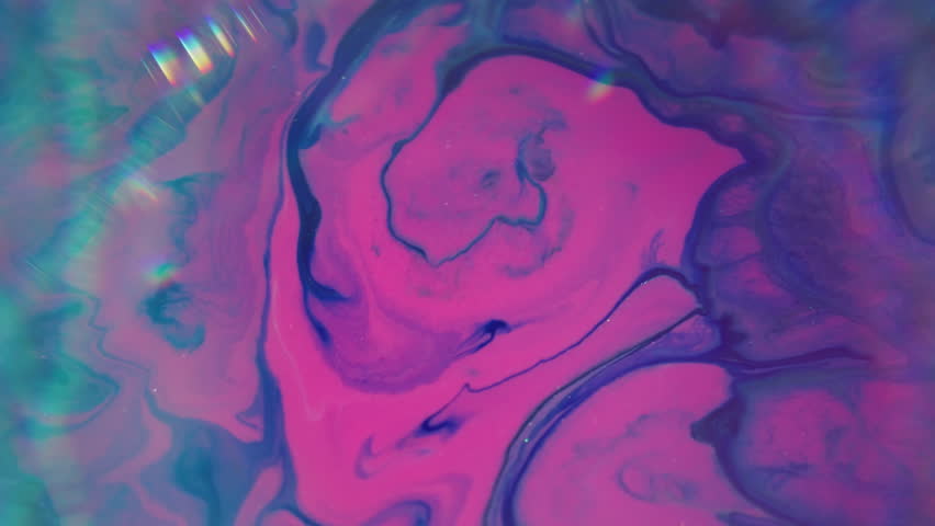 Blur vivid spill. Prism fluid. Neon color purple violet pink liquid leak light on bokeh frame lens flare abstract bright background paint mix.