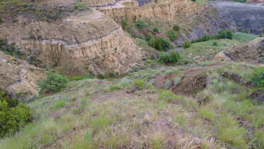 A sweeping panoramic view from the River Bend Overlook Trail in Theodore Roosevelt National Park captures the majestic Missouri vista