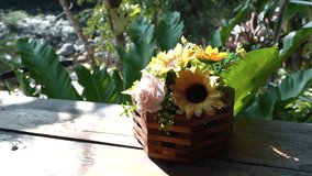 Artificial Sunflower and Rose Bouquet in a Vase on a Wooden Table , Plastic Flowers in a Rustic Vase - Powered by Shutterstock - Get 15% off with code: PIKWIZARD15