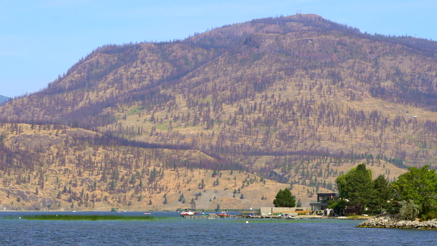 Semi arid dry mountain Kelowna Okanagan lake British Columbia Canada hot sunny summer day