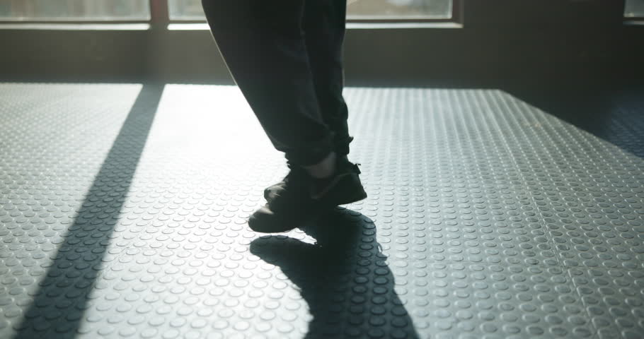 Boxing, feet and challenge with man in gym for sparring footwork, workout or mma. Exercise, martial arts and training with shoes of person or boxer in sports club for health, fight and athlete