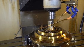 Slow motion scene the CNC milling machine finishing cut the brass shell mold parts with oil coolant method. The mold and die manufacturing process by CNC machining center. - Powered by Shutterstock - Get 15% off with code: PIKWIZARD15
