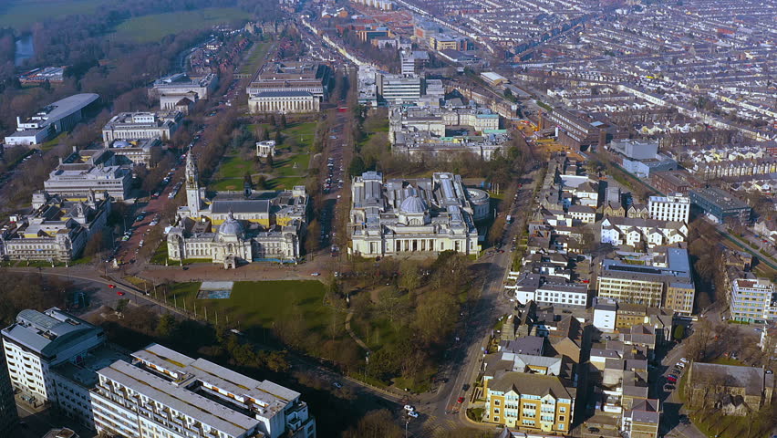 4K drone panorama of Cardiff’s Cathays Park civic centre - City Hall, National Museum Cardiff and Alexandra Gardens - framed by tree lined boulevards, Victorian terraces and the Welsh capital skyline.