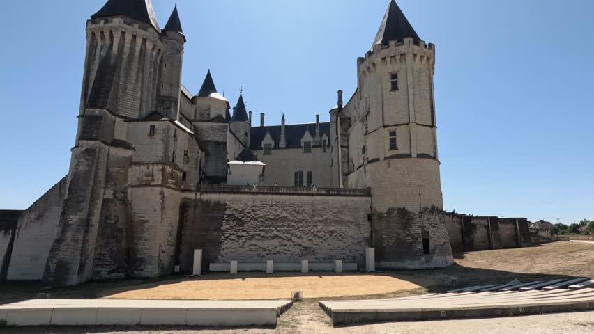Historic Saumur Chateau castle rises into blue sky in Loire, France