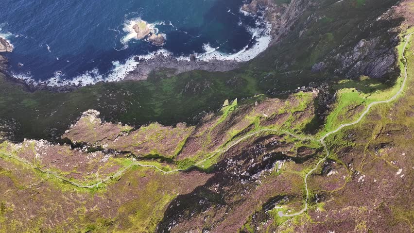 Aerial cinematic reveal of The Slieve League Cliffs ( Sliabg Liag ), Donegal, Ireland.