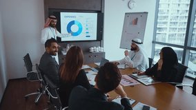 Arab businesswoman leads a meeting with diverse colleagues, discussing expenses and project development in a modern office setting, fostering collaboration and strategic decision-making - Powered by Shutterstock - Get 15% off with code: PIKWIZARD15