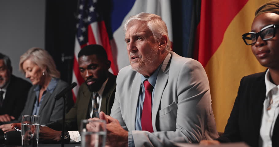 Press conference speech, politics and man with group, delegation or international government panel. Summit, people and politician talk at event for diplomacy discussion, global forum or policy update