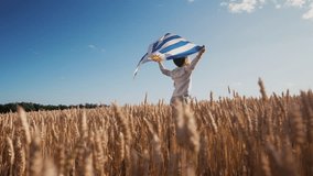 Patriot Boy Standing Wheat Field Holding Uruguayan Flag in the Wind, Uruguay - Powered by Shutterstock - Get 15% off with code: PIKWIZARD15