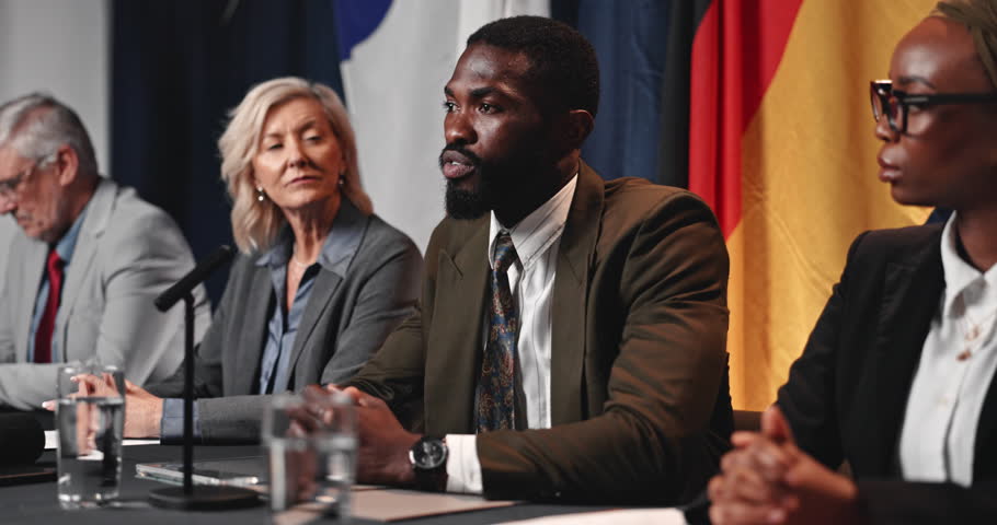 Press conference speech, politics and man with delegation, group or international government panel. Summit, people and politician talk at event for diplomacy discussion, global forum or policy update