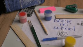Colorful assortment of stationery items on a desk featuring a handwritten back to school message, emphasizing creativity and readiness for learning. back to school concept  - Powered by Shutterstock - Get 15% off with code: PIKWIZARD15