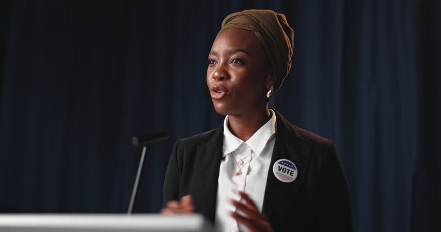 Politician, speech and black woman with microphone for press conference, seminar or forum on stage. Legislator, speaker and announcement for event, talking and policy update for election or vote