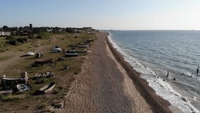 Dog walkers on the Lowestoft Beach on a warm summers morning in Suffolk, UK. 21.06.25 - Powered by Shutterstock - Get 15% off with code: PIKWIZARD15