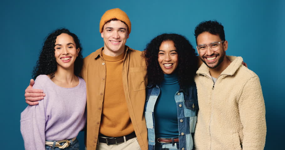 Face, laugh or group with fashion in studio for upcycling campaign, about us or sustainable clothing. Happy, people and hug on blue background for eco friendly brand promo, cozy community and pride