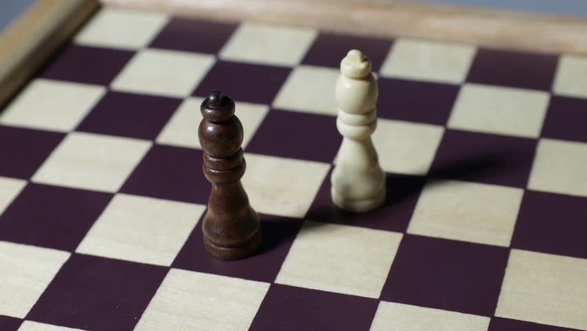 Cinematic shot of queens on a chessboard.