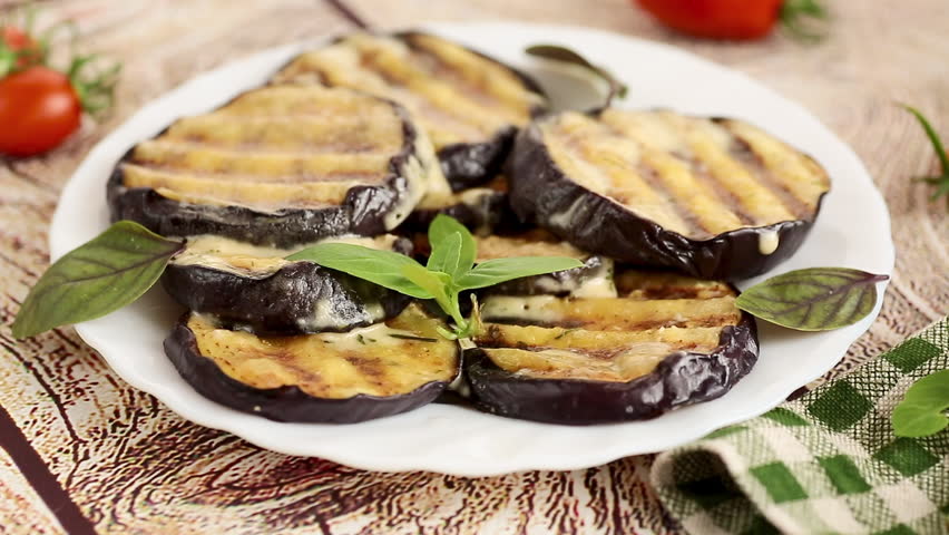 Homemade eggplant appetizer with garlic, herbs and cheese
