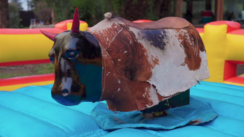 Mechanical bull Fiestas Patrias chile pennant stars santiago sky grass elements red blue white