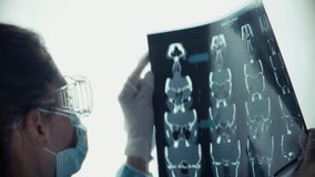 Medical Professional Examining X-Ray Scan. Doctor Analyzing Patient's Results. Diagnosis And Analysis Radiology Specialist. Clinical Expertise Disease Detection. Doctor Work Physician Expertise Clinic - Powered by Shutterstock - Get 15% off with code: PIKWIZARD15