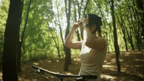 Cyclist Putting On Bike Helmet. Cycling Adventure Preparation Mountain Biking Safety Gear. Cyclist Preparing For Ride. Athlete Getting Ready. Fitness In Nature Protective Headwear Forest Biking Gear - Powered by Shutterstock - Get 15% off with code: PIKWIZARD15