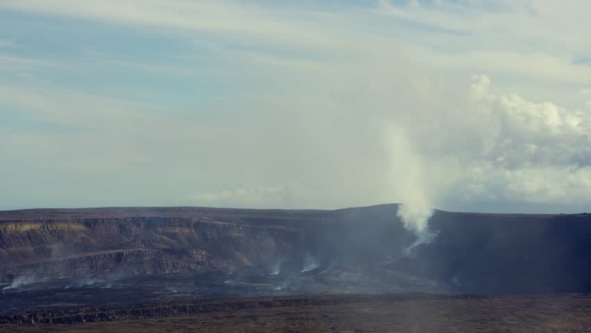 Active Kilauea volcano caldera emitting smoke and steam from Halemaʻumaʻu crater, Hawaiʻi Volcanoes National Park, Big Island