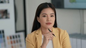 businesswoman at organized desk writing down goals and ideas for company improvement strategy - Powered by Shutterstock - Get 15% off with code: PIKWIZARD15