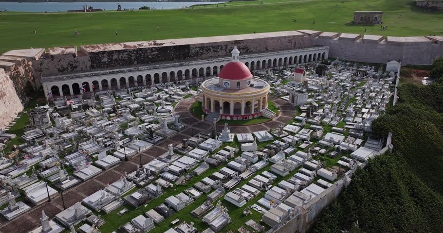 Cinematic aerial footage of Santa Maria Magdalena de Pazzis Cemetery, located along the Atlantic coastline in Old San Juan, Puerto Rico
