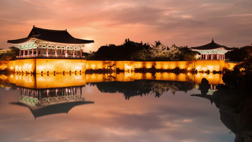 The pavilions of Anapji Pond reflected in the water in Gyeongju.The Gyeongju Historic Areas of South Korea were designated as a World Heritage Site by UNESCO in 2000, ref 976. Golden hour view.