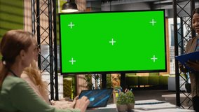 Goals oriented businesswomen work around a mockup TV monitor with papers, empowered by data and determination for performance analytics and planning tools. Work environment. Camera B. - Powered by Shutterstock - Get 15% off with code: PIKWIZARD15