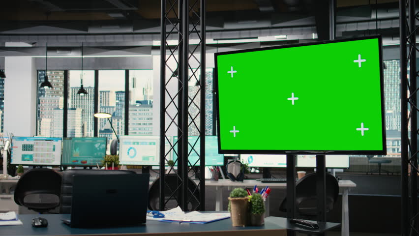 Clean professional office workstation with copy space mockup TV screen, space prepared with reports and digital devices. Business management to dive into charts and performance indicators.