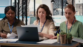 Team of career focused women aligning analytics and objectives, reviewing financial performance data to lead company toward success in a smart and collaborative work environment. Camera B. - Powered by Shutterstock - Get 15% off with code: PIKWIZARD15