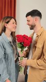 A loving couple enjoying an intimate moment as they kiss, surrounded by a stunning bouquet of vibrant red roses, capturing the essence of romance and affection in their joyful expressions. - Powered by Shutterstock - Get 15% off with code: PIKWIZARD15