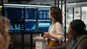 Businesswomen in a meeting symbolizing productivity in modern office, reviewing analytics in order to refine company vision and objectives. Professionalism and corporate feminism. Camera A. - Powered by Shutterstock - Get 15% off with code: PIKWIZARD15