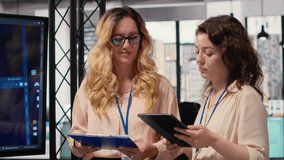 Team of colleagues using strategic artificial intelligence cloud computing to conduct data analysis, optimized decision making and project forecasting. Development with automation. Camera B. - Powered by Shutterstock - Get 15% off with code: PIKWIZARD15