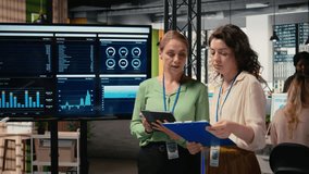 Women employees using performance data analysis to build a strategy in a progressive multinational company, team empowerment for accelerate project goals through efficient planning. Camera A. - Powered by Shutterstock - Get 15% off with code: PIKWIZARD15