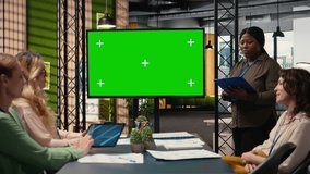 Goals oriented businesswomen work around a mockup TV monitor with papers, empowered by data and determination for performance analytics and planning tools. Work environment. Camera A. - Powered by Shutterstock - Get 15% off with code: PIKWIZARD15