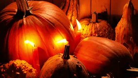 Thanksgiving design and Halloween-themed backgrounds.Pumpkins and flickering candles casting light in the darkness. 4k footage - Powered by Shutterstock - Get 15% off with code: PIKWIZARD15