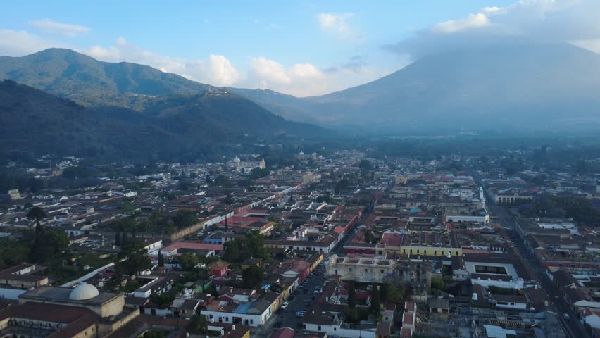 Flying over Antigua Guatemala with the majestic Volcan de Agua rising in the distance