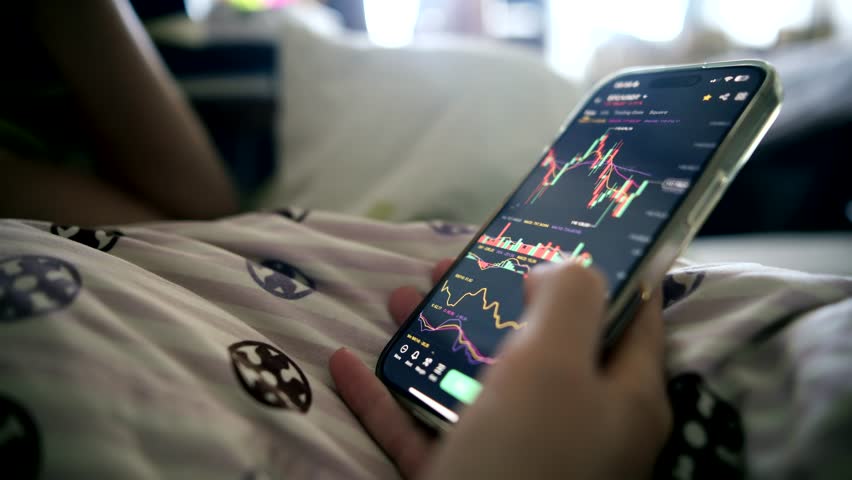 Smartphone Trading App. Checking Stock Market On Phone. Financial Analysis. Mobile Investment Application. Cryptocurrency Trading Graph. Analyzing Market Trends. Passive Income Strategy Cryptocurrency