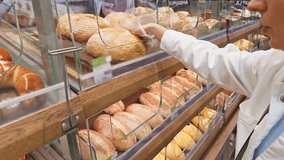 Stocking Shelves In Supermarket. Freshly Baked Products In A Bakery. Grocery Shopping For Fresh Bread. Artisan Loaves. Rye Bread And Multigrain. Customer Choosing Loaf Of Bread. Baked Goods In Store - Powered by Shutterstock - Get 15% off with code: PIKWIZARD15