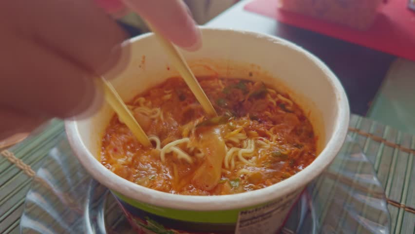 Instant Ramen Noodles. Delicious Spicy Asian Soup. Quick And Easy Meal. Hot And Appetizing Lunch. Convenient Fast Food Dish. Cooking Instant Ramen. Eating Asian Noodles Instant Meal. Unhealthy Food
