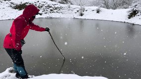 Frozen lake in forest panoramic view of heavy snowfall in winter cold season in Hyrcanian woman wear red jacket hiking adventure nature countryside mountain scenic landscape peaceful icy pond in Iran - Powered by Shutterstock - Get 15% off with code: PIKWIZARD15