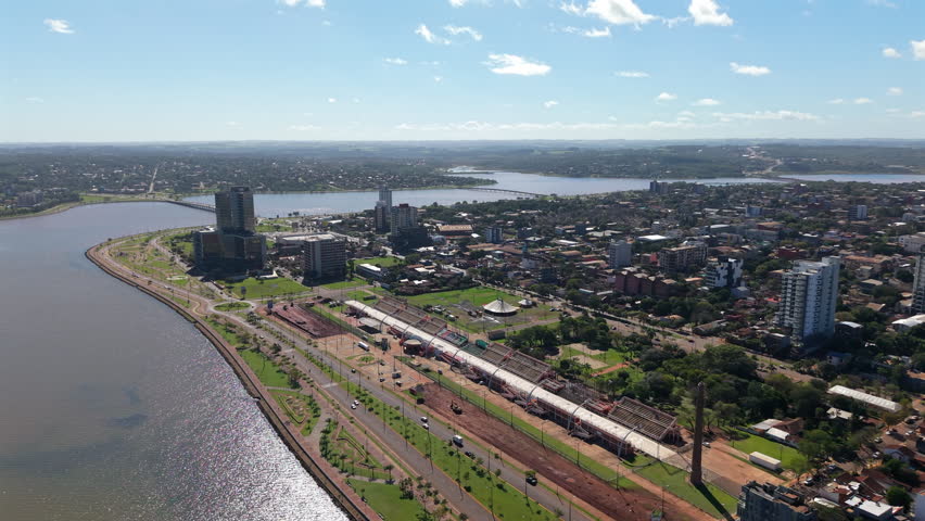 Panorama drone view of the Encarnación city waterfront greenery and residential district, Itapúa, Paraguay.