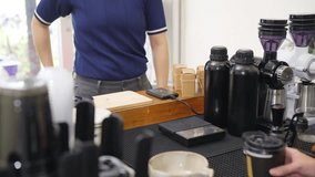 Small business entrepreneur barista coffee shop cafe restaurant. Customer tap credit card on card swipe machine making online banking payment buy coffee at cashier counter. Cashless payment technology - Powered by Shutterstock - Get 15% off with code: PIKWIZARD15